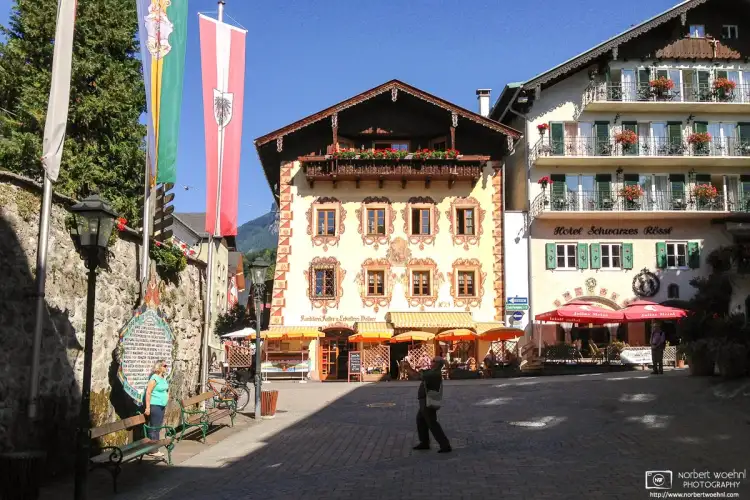 Visitors capturing memories in the beautiful historic town center of Sankt Wolfgang im Salzkammergut, Austria.