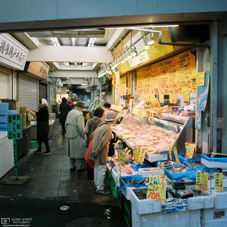 Customers are looking at meat and seafood offered by this shop in Shimo-Takaido in the Setagaya Ward of Tokyo, Japan.