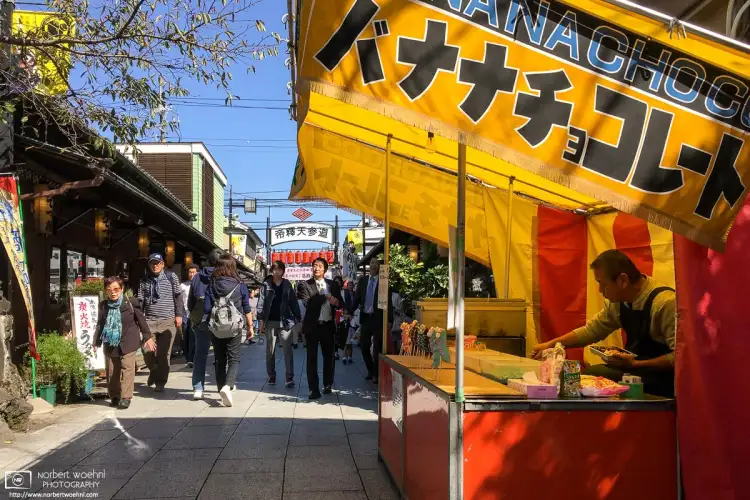 A street vendor is selling chocolate-coated bananas in the Shibamata area of Tokyo, Japan.