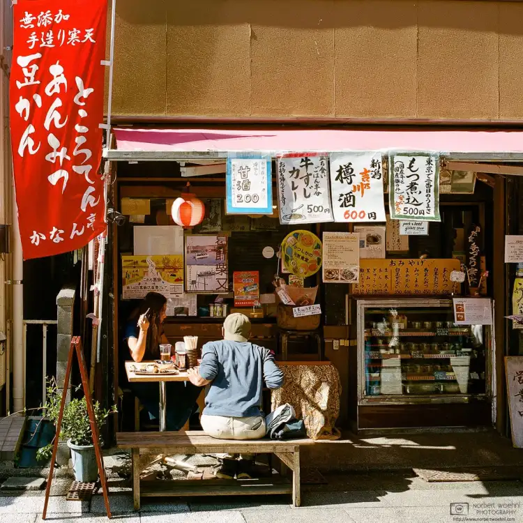 Scene outside a typical traditional street food place in the traditional Shibamata area in the northeast of Tokyo, Japan.
