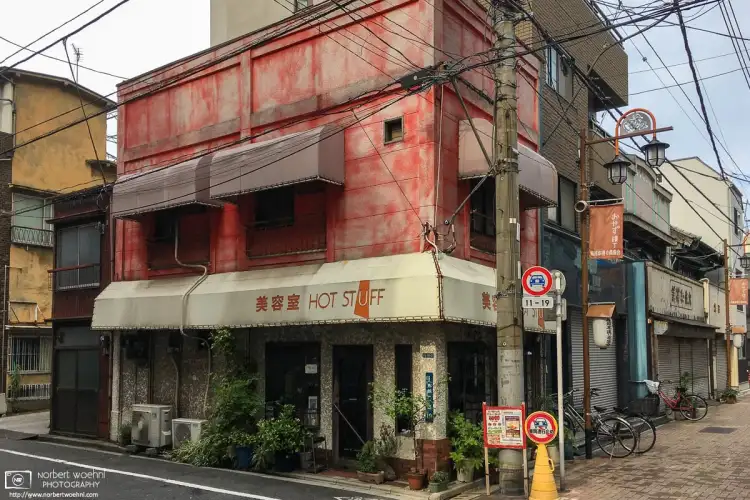An ambitiously-named hairdresser and beauty salon in a beautifully weathered old building in the Taito Ward of Tokyo, Japan.
