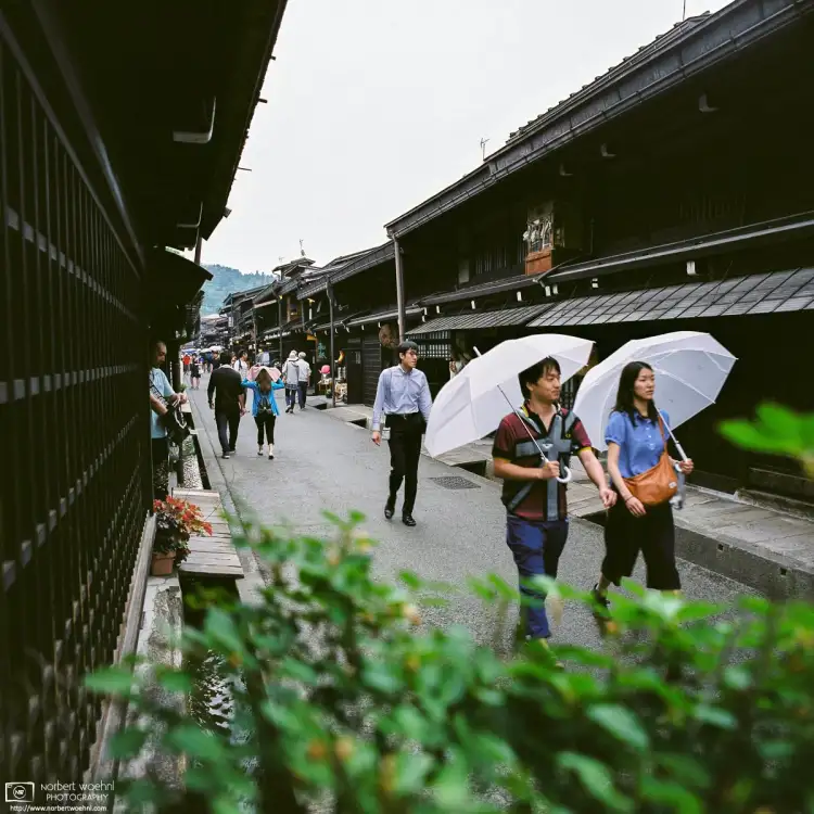 Walking through the Old Town of Takayama in Gifu Prefecture, Japan, this photo looks down Sannomachi Street on a rainy afternoon.