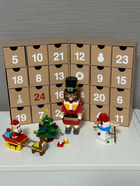 An advent calendar filled with chocolates, and some small holiday-themed LEGO figures as a Christmas decoration in our apartment in Tokyo, Japan.
