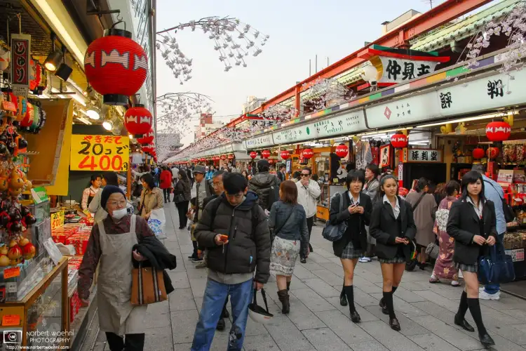 High school girls on Nakamise-dori, the shop-lined approach to Sensoji Temple in Asakusa, Tokyo, Japan.