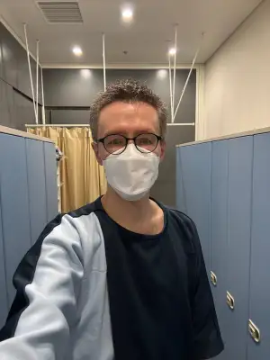 Changed into the hospital gowns and ready for the medical checkup.