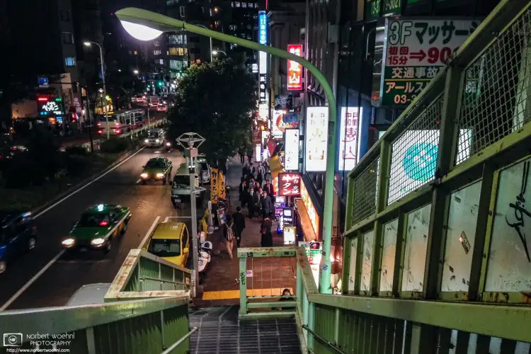 An evening view from an overpass on Meguro Dori, a major thoroughfare near Meguro Station in Tokyo, Japan.