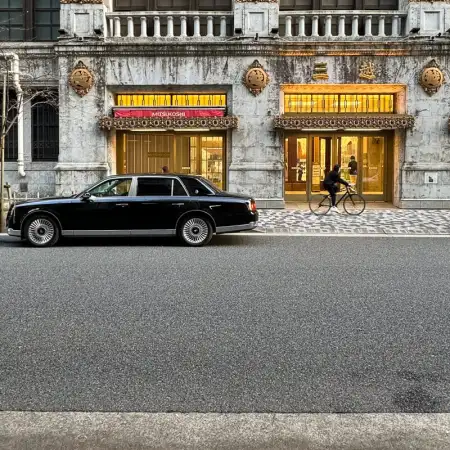 A Toyota Century is parked in front of the ornate side entrance to Mitsukoshi Department Store in Nihonbashi, Tokyo, Japan.