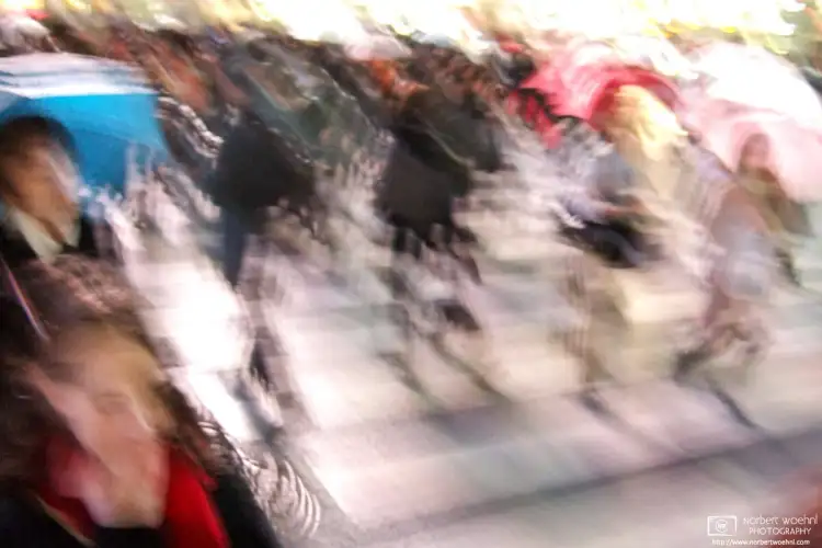 That feeling of walking across the famous Shibuya Scramble Crossing in Tokyo, Japan, as a part of the crowd on a rainy day.