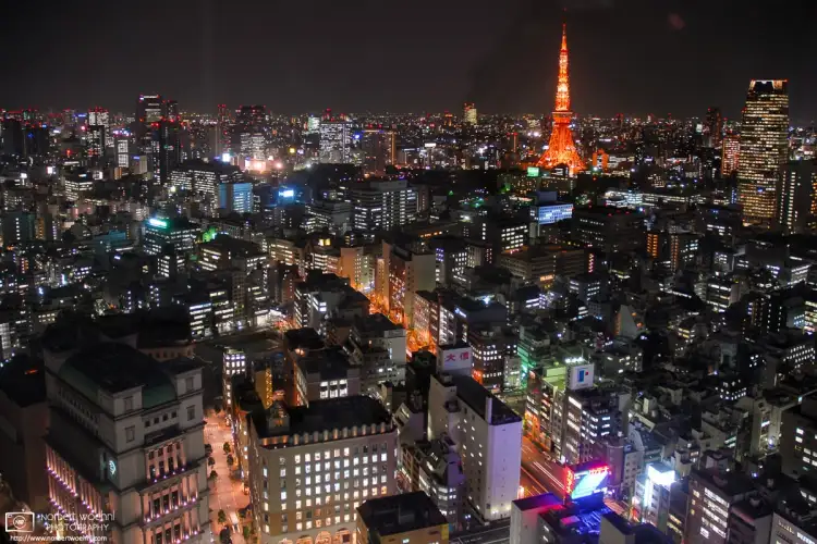 Night view towards an illuminated Tokyo Tower from a hotel room at the Park Hotel Shiodome in Tokyo, Japan. Photo taken in 2006.
