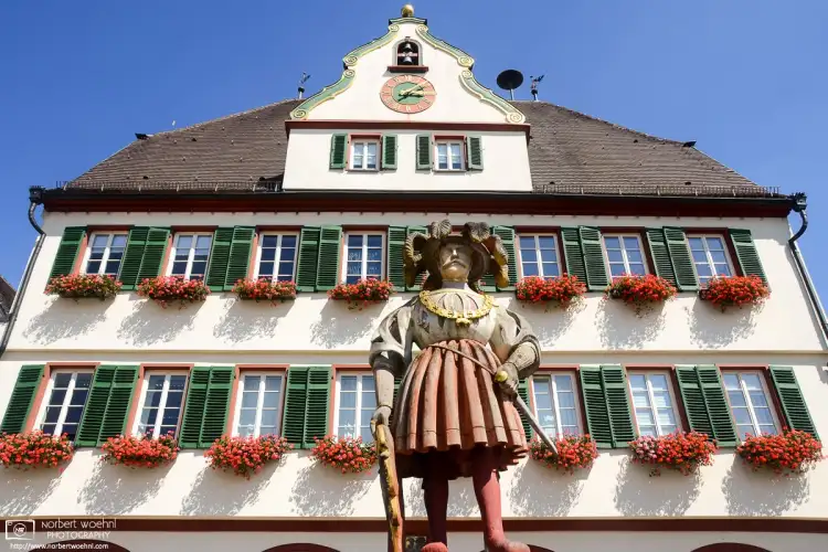 A view of the statue atop the 1537 Market Fountain in front of the City Hall of Weil der Stadt, Germany.