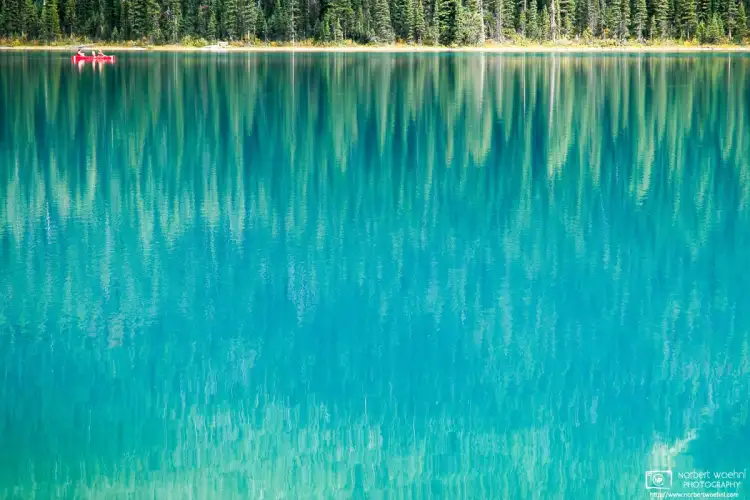 Beautiful turquoise Emerald Lake in Yoho National Park, surrounded by a forest of Engelmann spruce, is covered in ice most of the year.